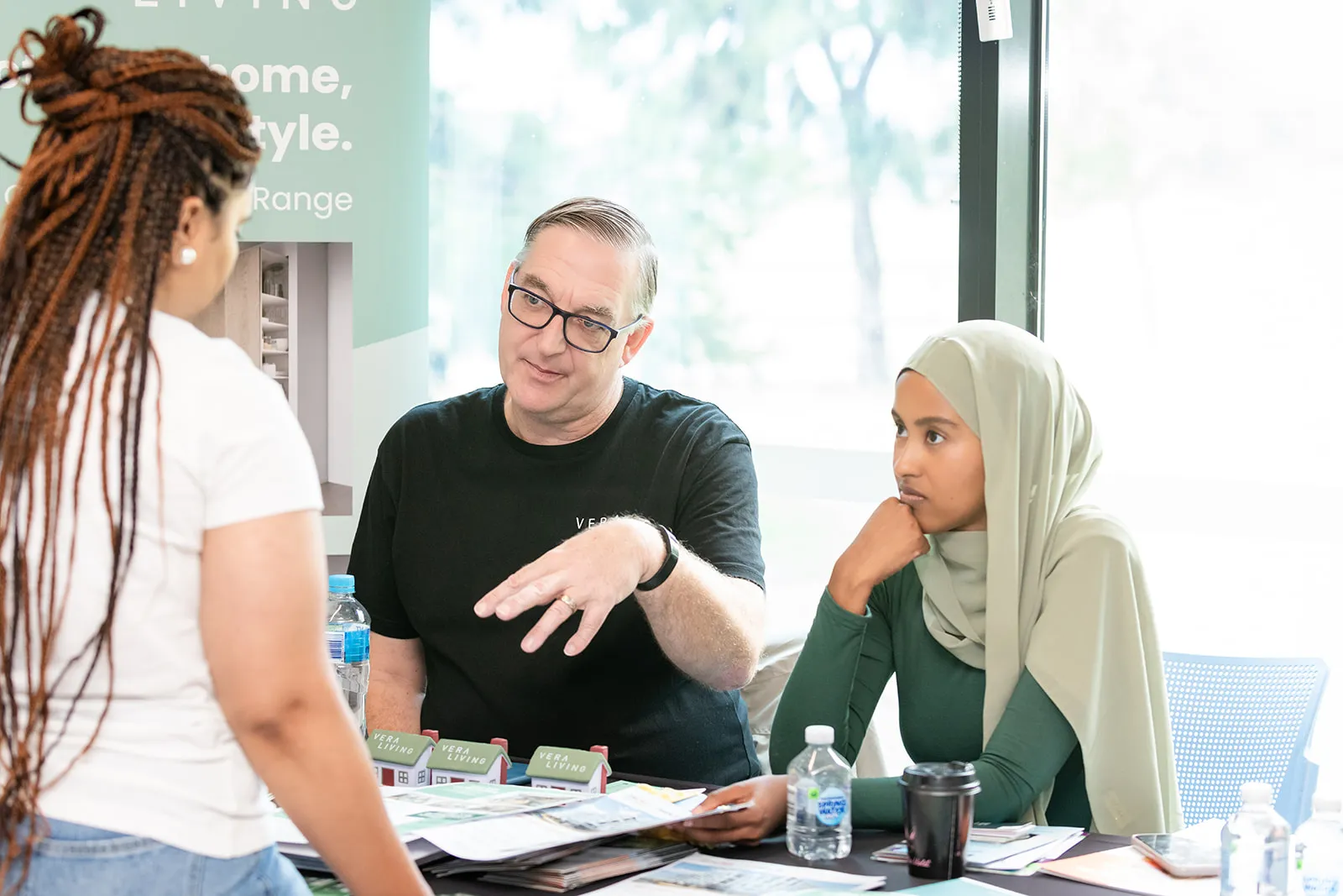 Vera Living staff talking to someone at an expo