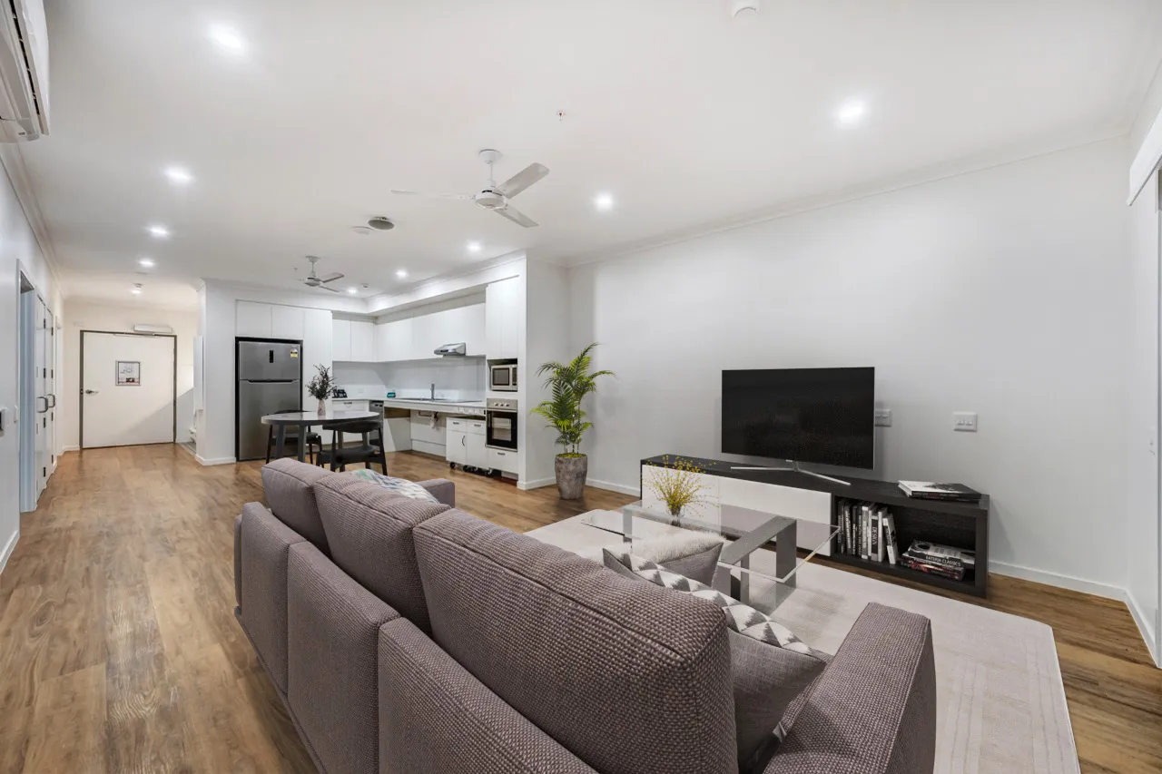 Kitchen and living area with wood floors