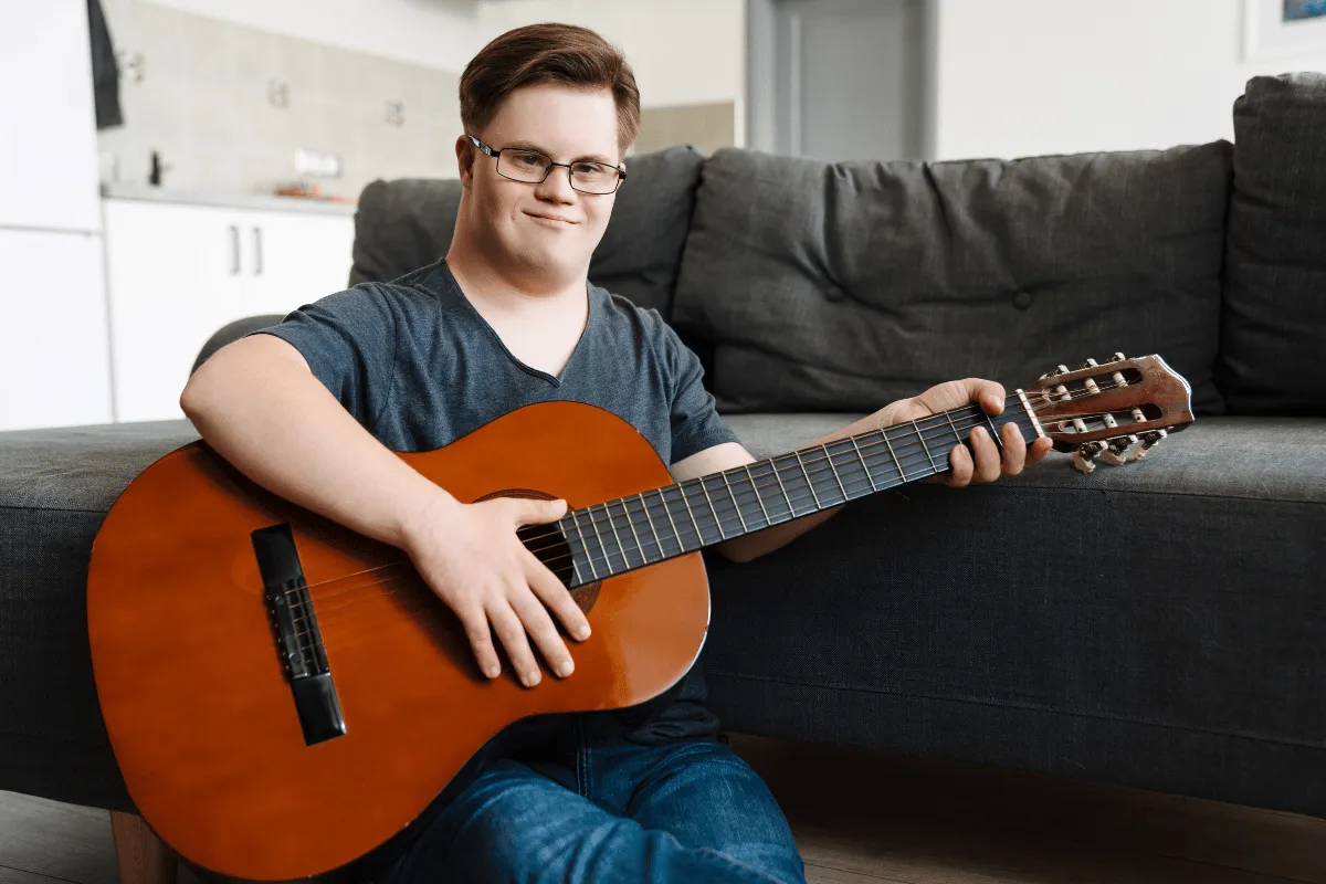 A man playing a guitar