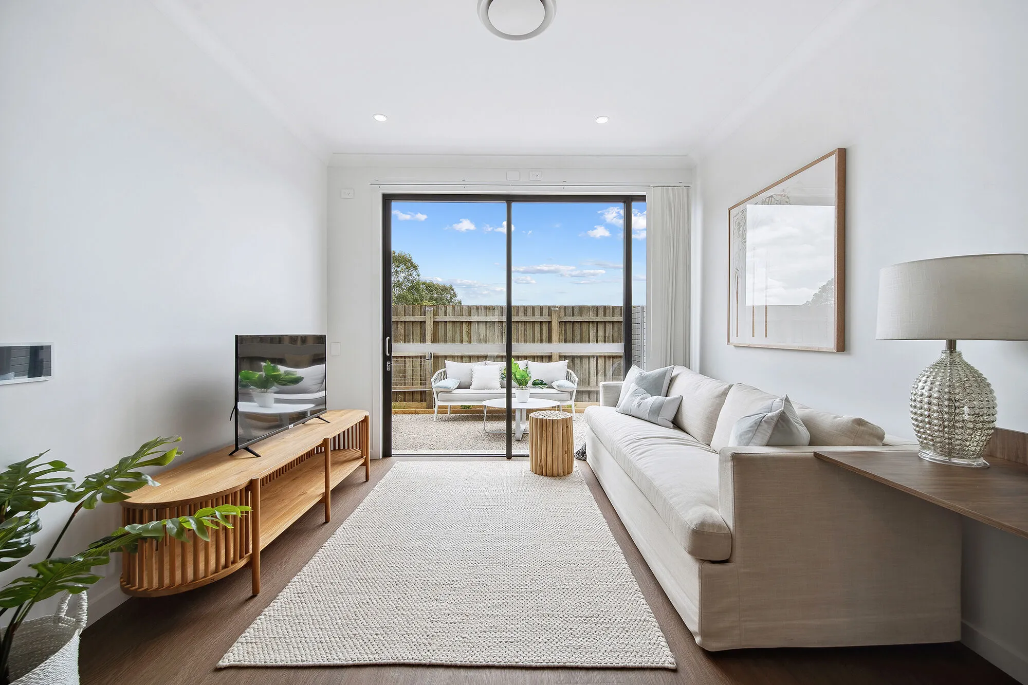 A loungeroom looking out to a courtyard
