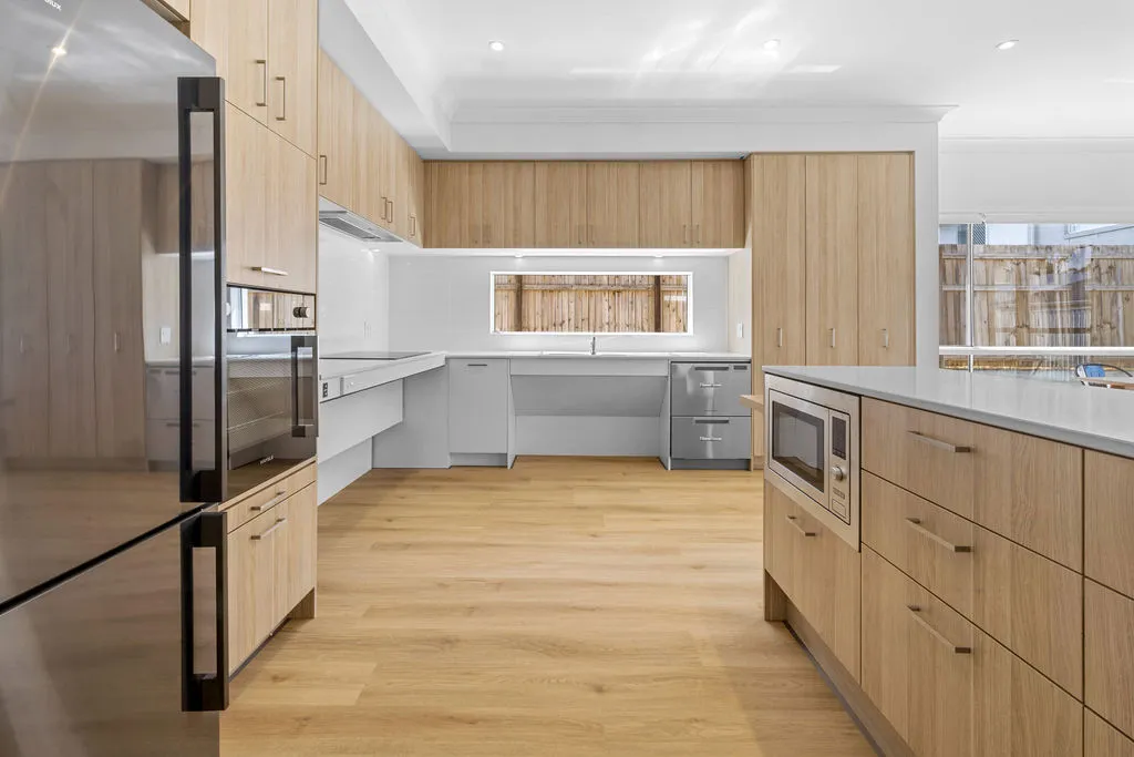 A kitchen with wooden floors