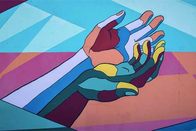 A colourful artwork of two hands