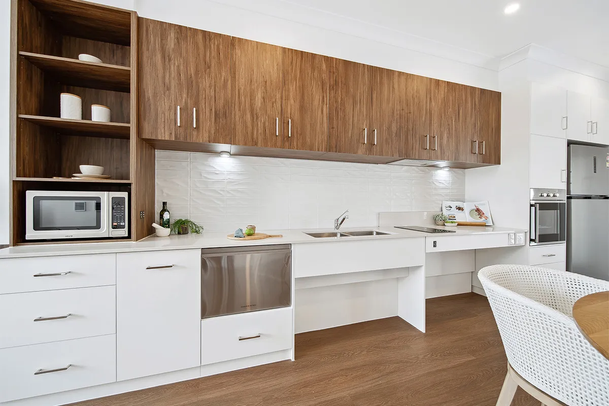 A kitchen with wooden floors and shelves