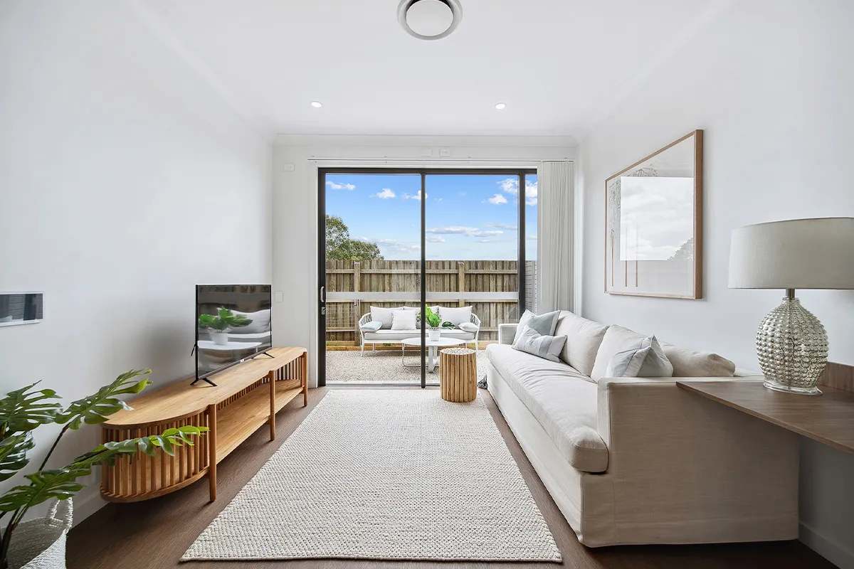 A loungeroom leading to a back deck