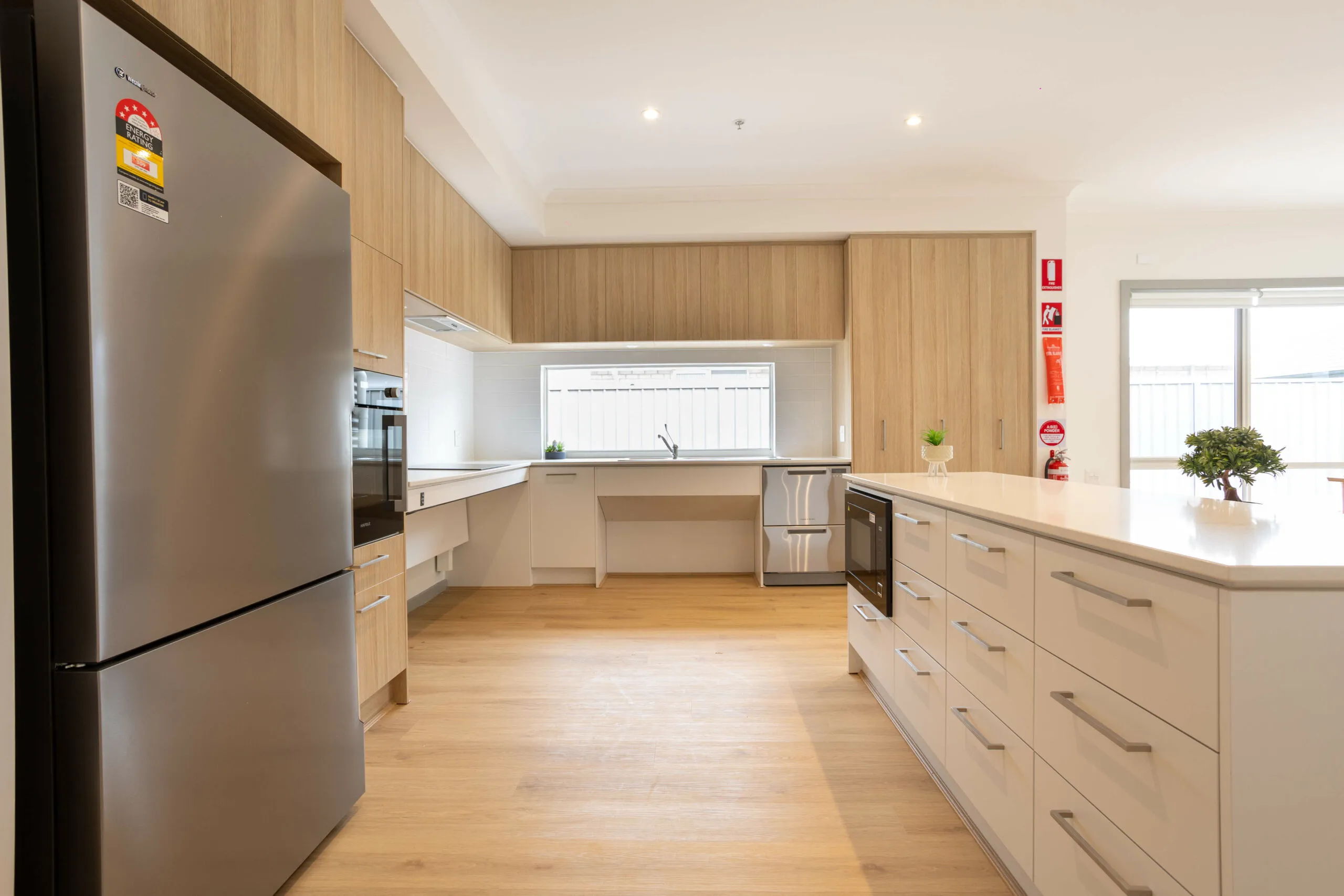 A kitchen with wood floors