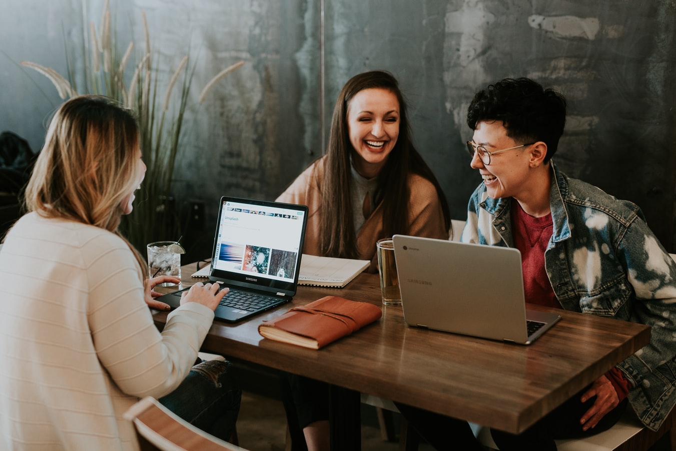 Image of group of people working together and laughing